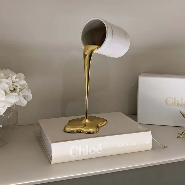 Molten Gold Paint Spill Ornament: Glam for Your Space